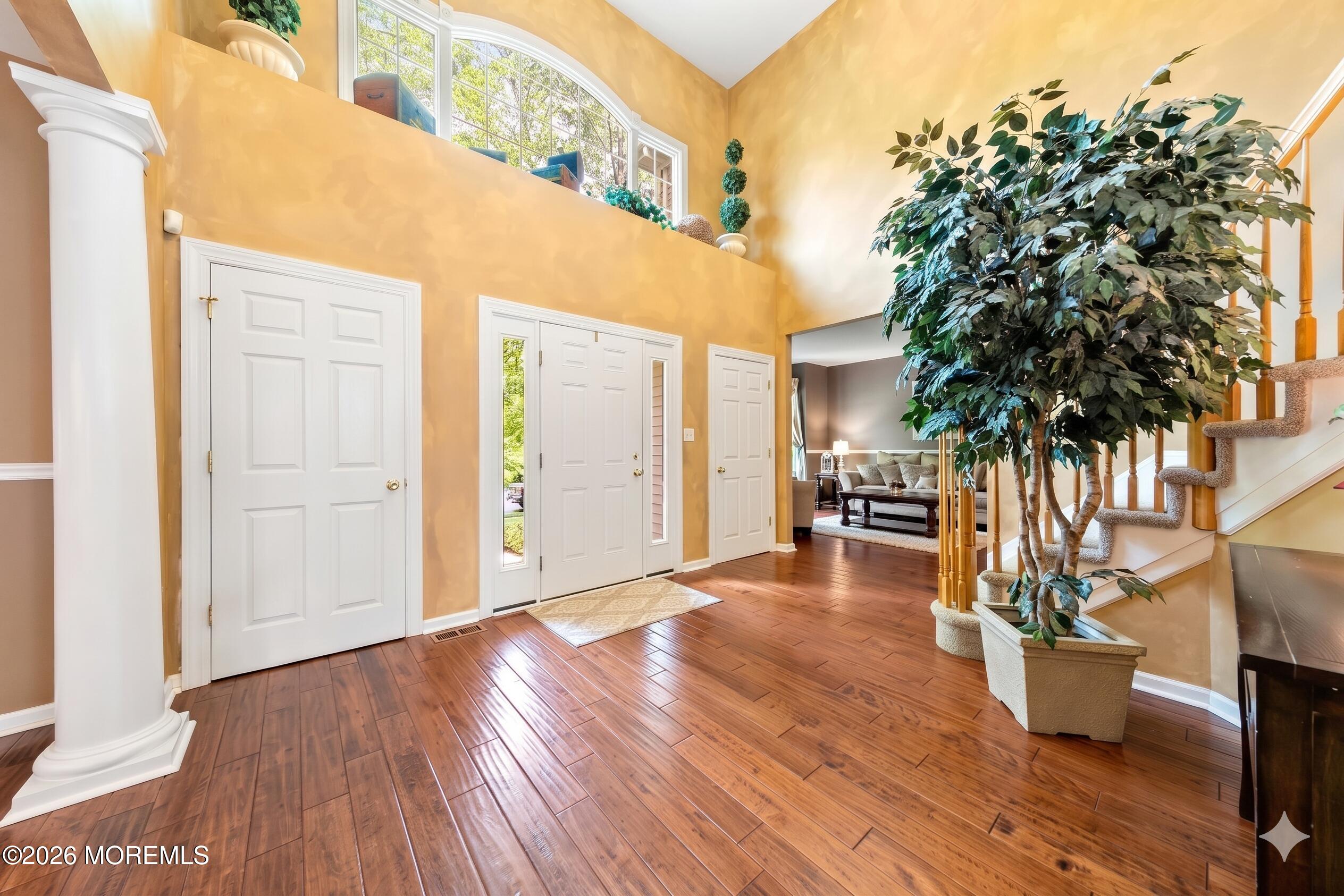2 Mehar Court Jackson, NJ 08527 - Photo 6 of 47 a view of a patio with table and chairs and potted plants with wooden floor and fence