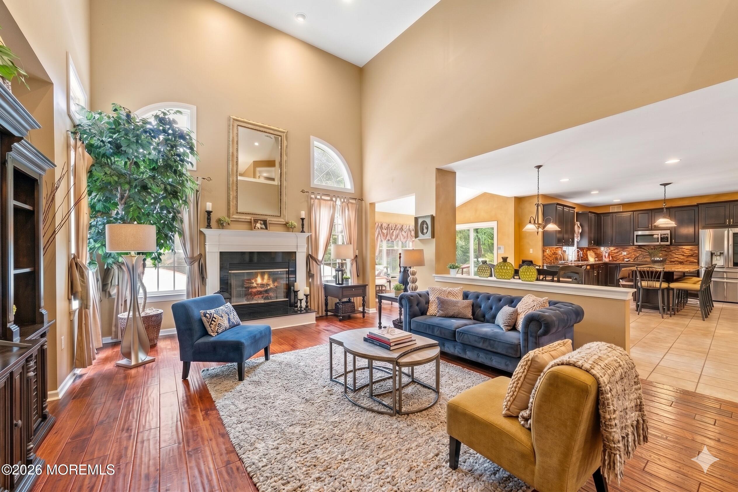 2 Mehar Court Jackson, NJ 08527 - Photo 8 of 47 a living room with furniture wooden floor and a fireplace