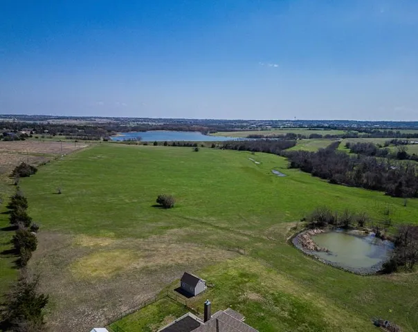 a view of a water pond with green space