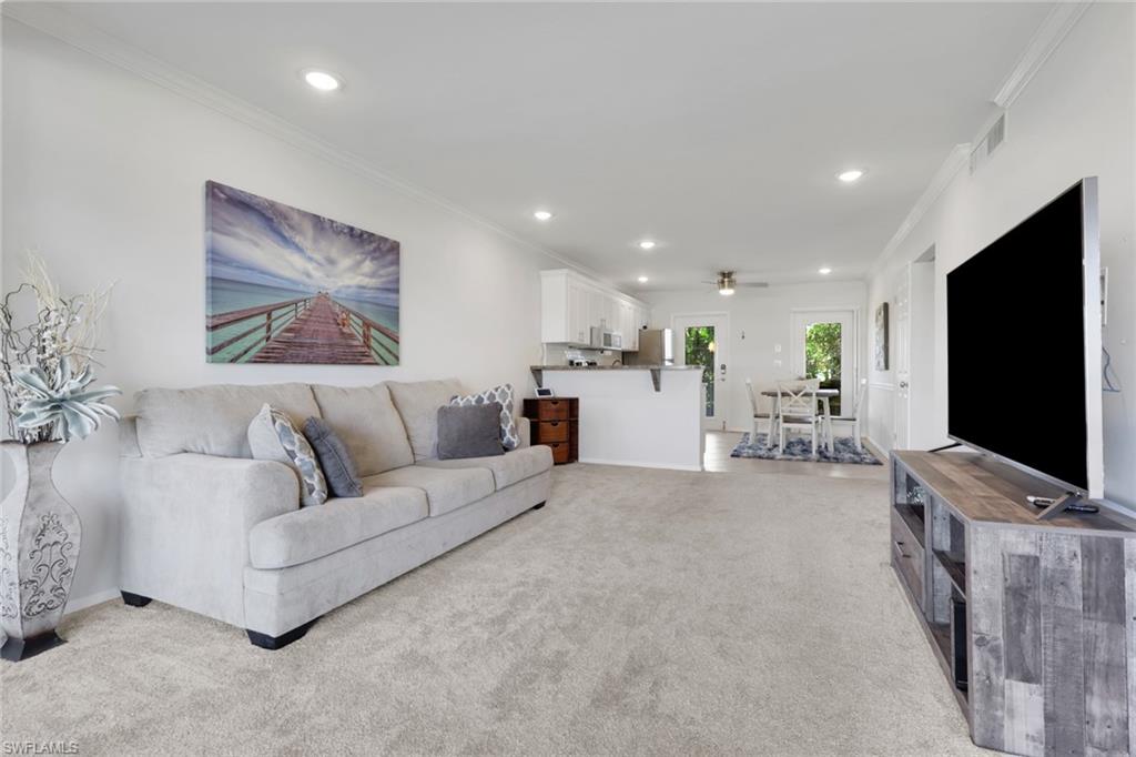 466 12th Avenue South, Unit 466 Naples, FL 34102 - Photo 17 of 34 a living room with furniture and a flat screen tv