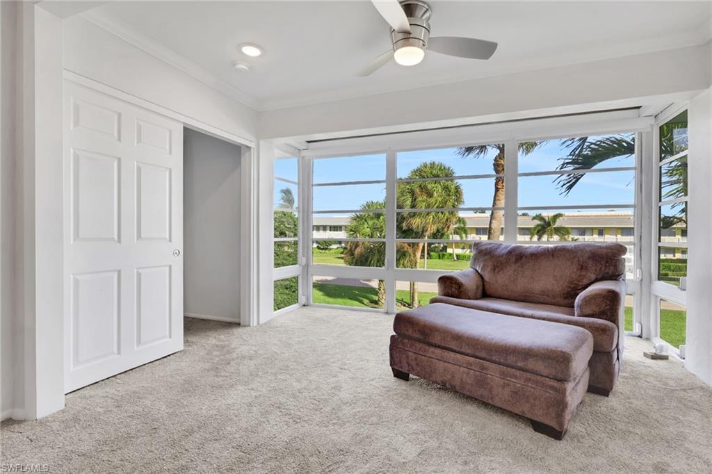 466 12th Avenue South, Unit 466 Naples, FL 34102 - Photo 21 of 34 a living room with furniture and a large window