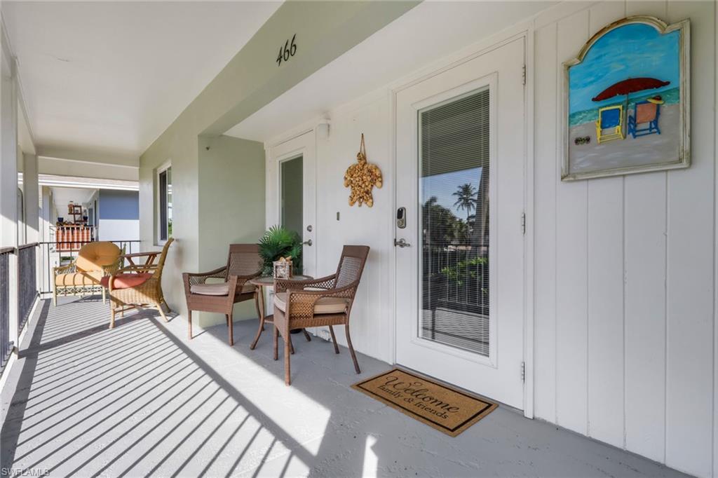 466 12th Avenue South, Unit 466 Naples, FL 34102 - Photo 3 of 34 a living room with furniture and a window