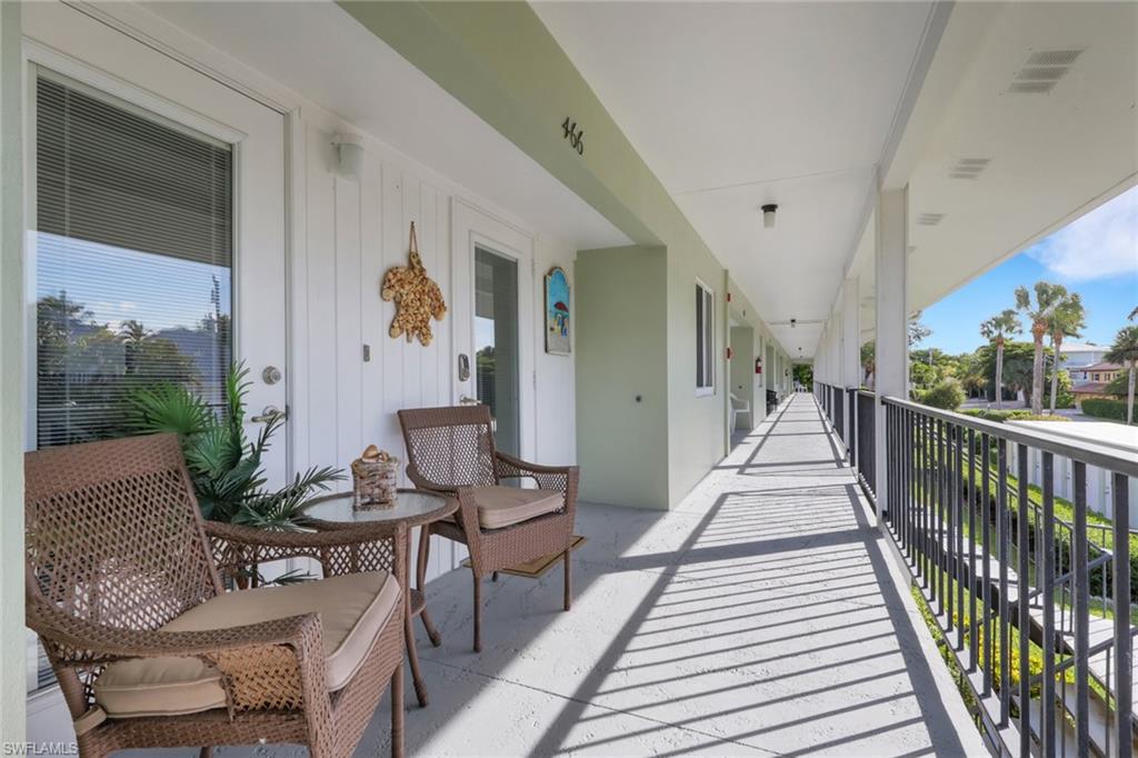 466 12th Avenue South, Unit 466 Naples, FL 34102 - Photo 5 of 34 a building outdoor space with patio furniture