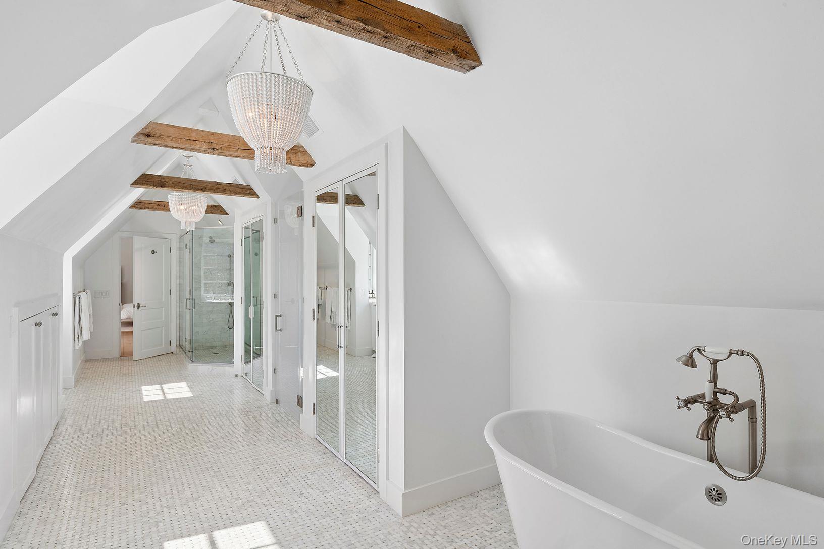 123 Abrahams Path East Hampton, NY 11937 - Photo 12 of 27 a bathroom with a bathtub and shower