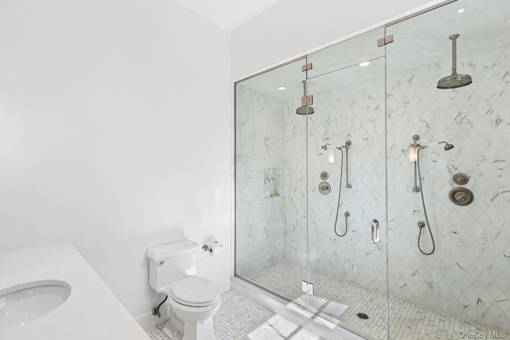 123 Abrahams Path East Hampton, NY 11937 - Photo 15 of 27 a bathroom with a shower a toilet and sink