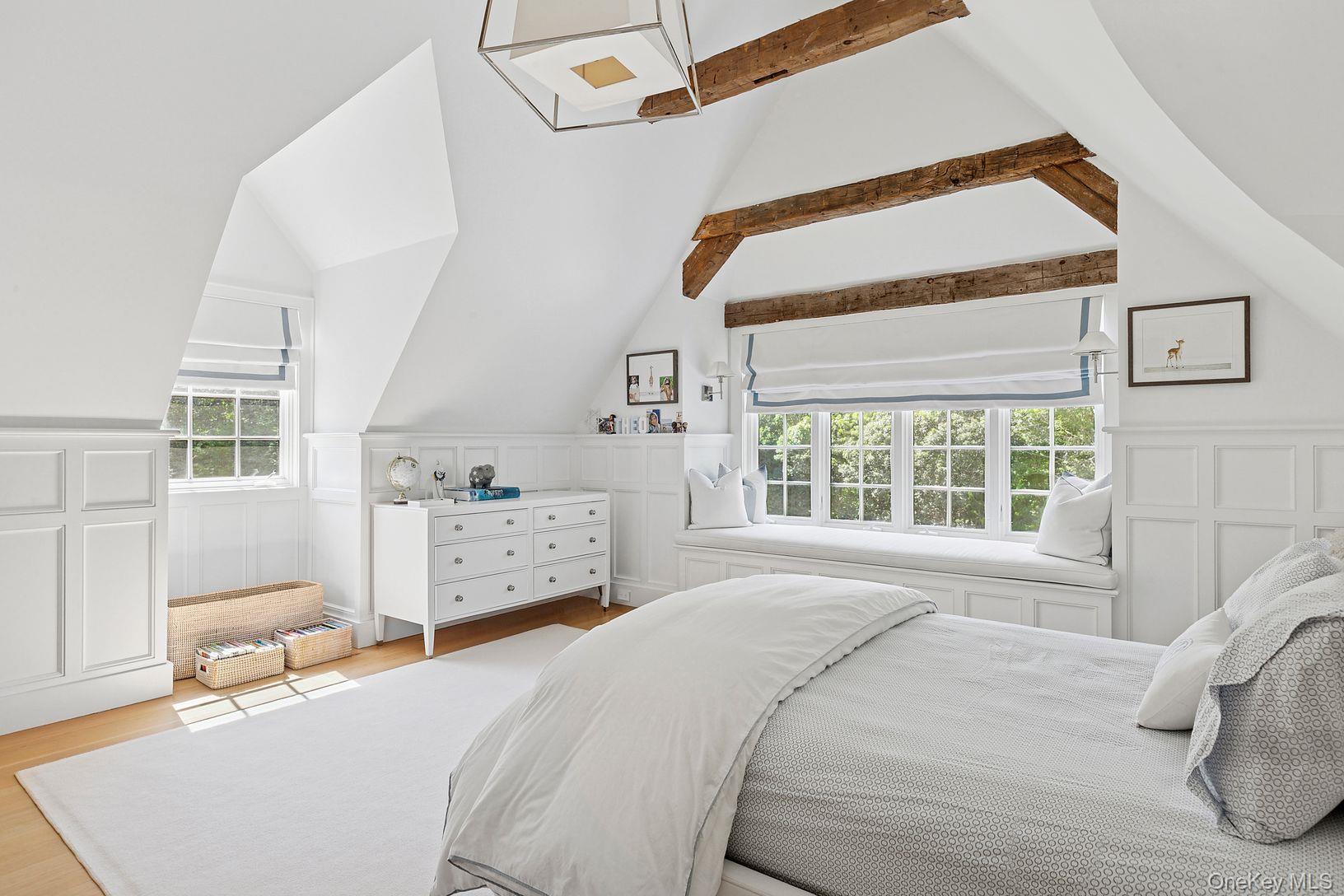 123 Abrahams Path East Hampton, NY 11937 - Photo 16 of 27 a bedroom with a bed and a window