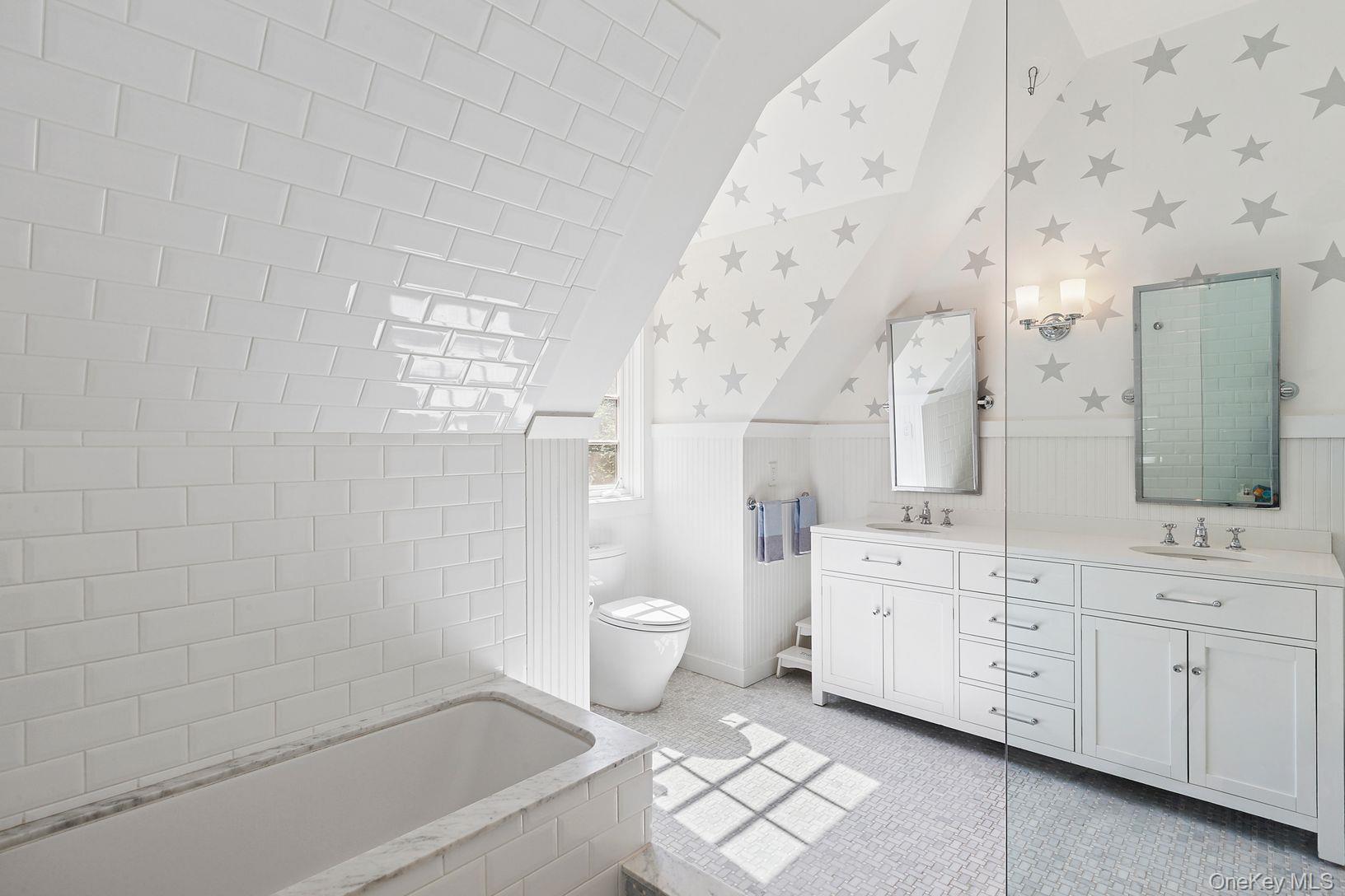 123 Abrahams Path East Hampton, NY 11937 - Photo 17 of 27 a bathroom with a granite countertop sink a toilet and bathtub