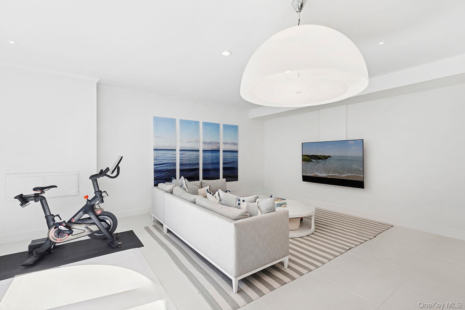 123 Abrahams Path East Hampton, NY 11937 - Photo 19 of 27 a living room with furniture and a flat screen tv