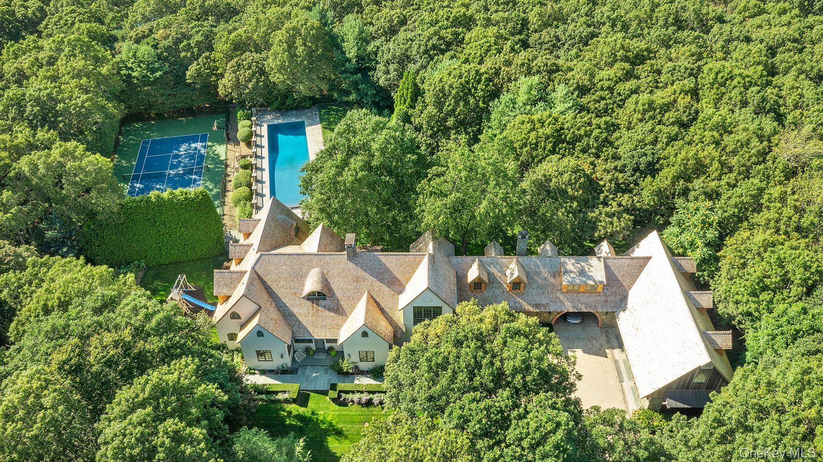 123 Abrahams Path East Hampton, NY 11937 - Photo 2 of 27 an aerial view of a house with outdoor space and trees all around