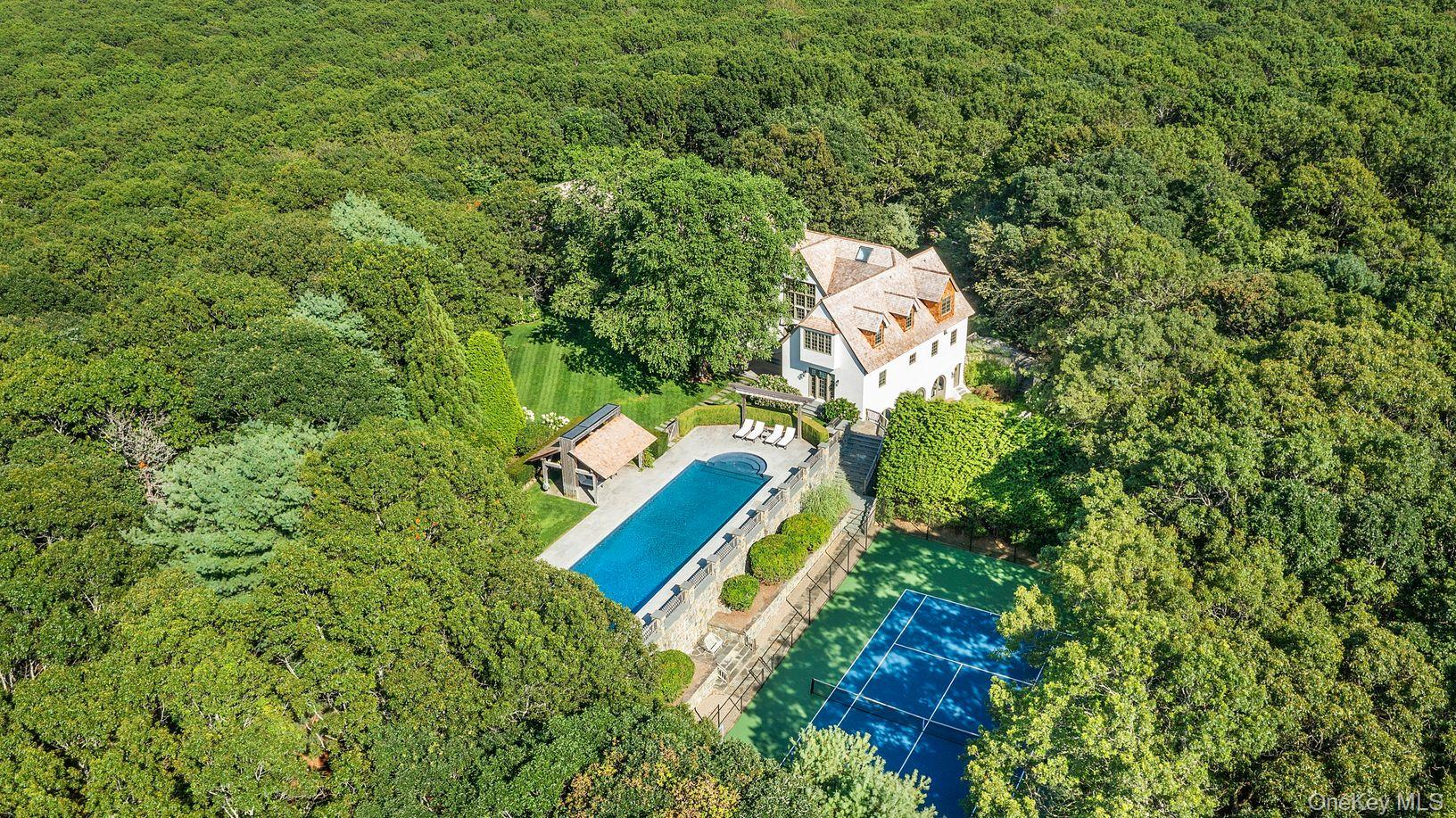 123 Abrahams Path East Hampton, NY 11937 - Photo 26 of 27 a view of a house with a backyard