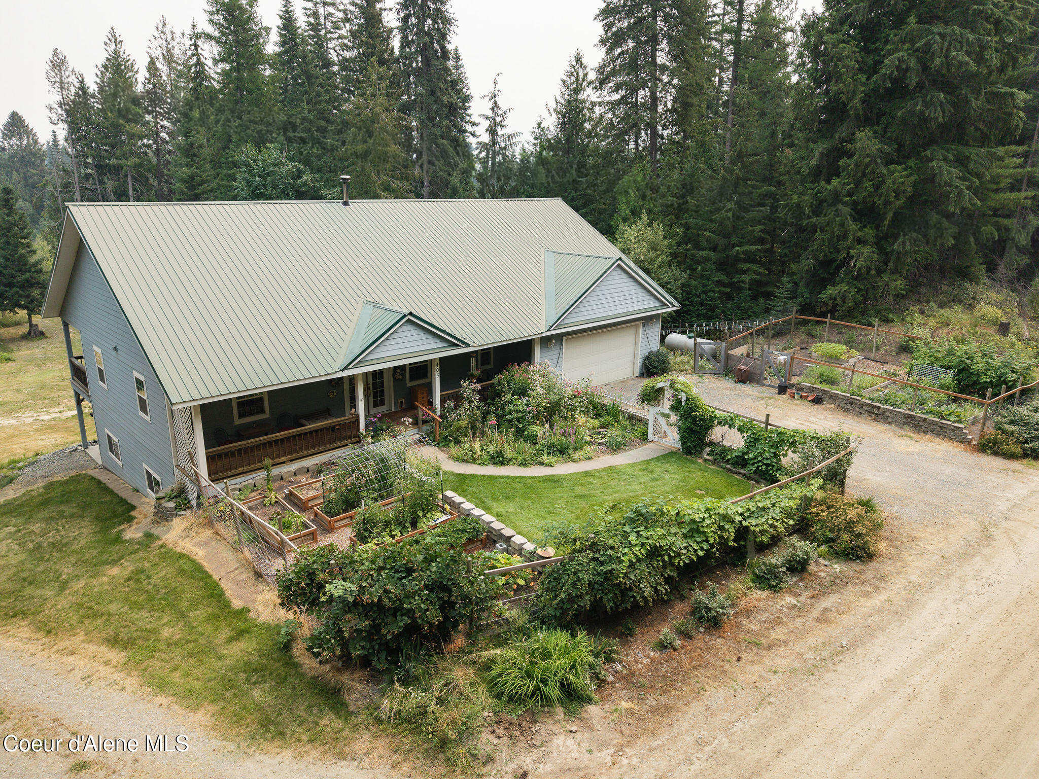 403 Fall Creek Road Naples, ID 83847 - Photo 3 of 65 003_Aerial_Front_Gardens_3