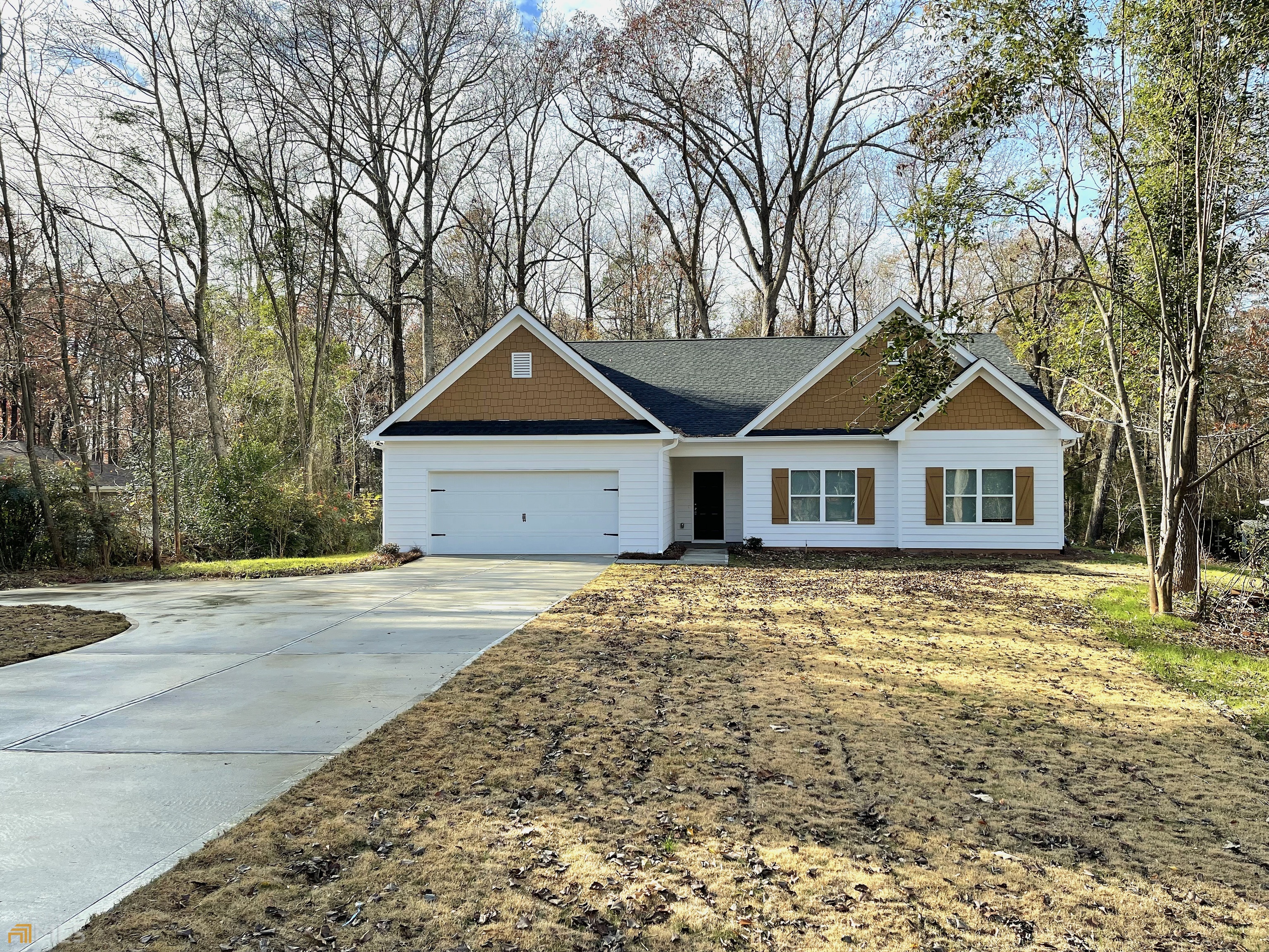 8299 Jefferson Road Commerce, GA 30529 - Photo 1 of 1 a front view of a house with a yard and garage