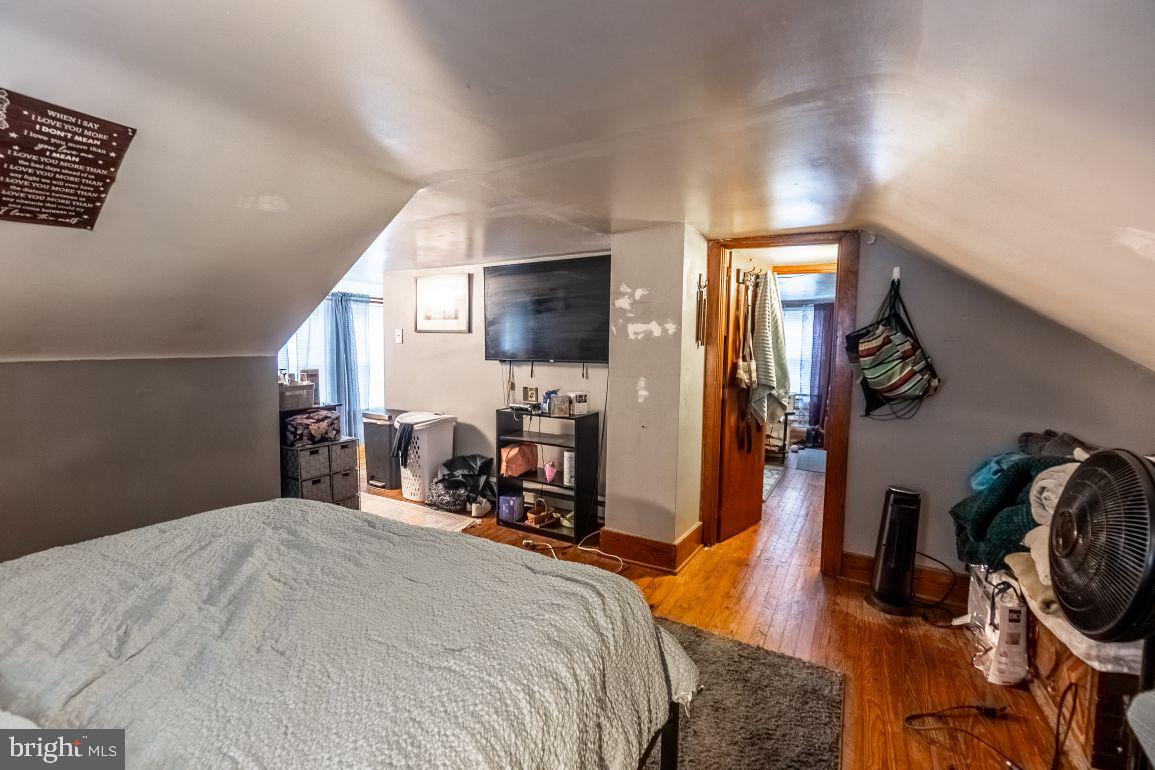 62 McKinley Avenue Hanover, PA 17331 - Photo 10 of 17 a bedroom with a bed a mirror and desk