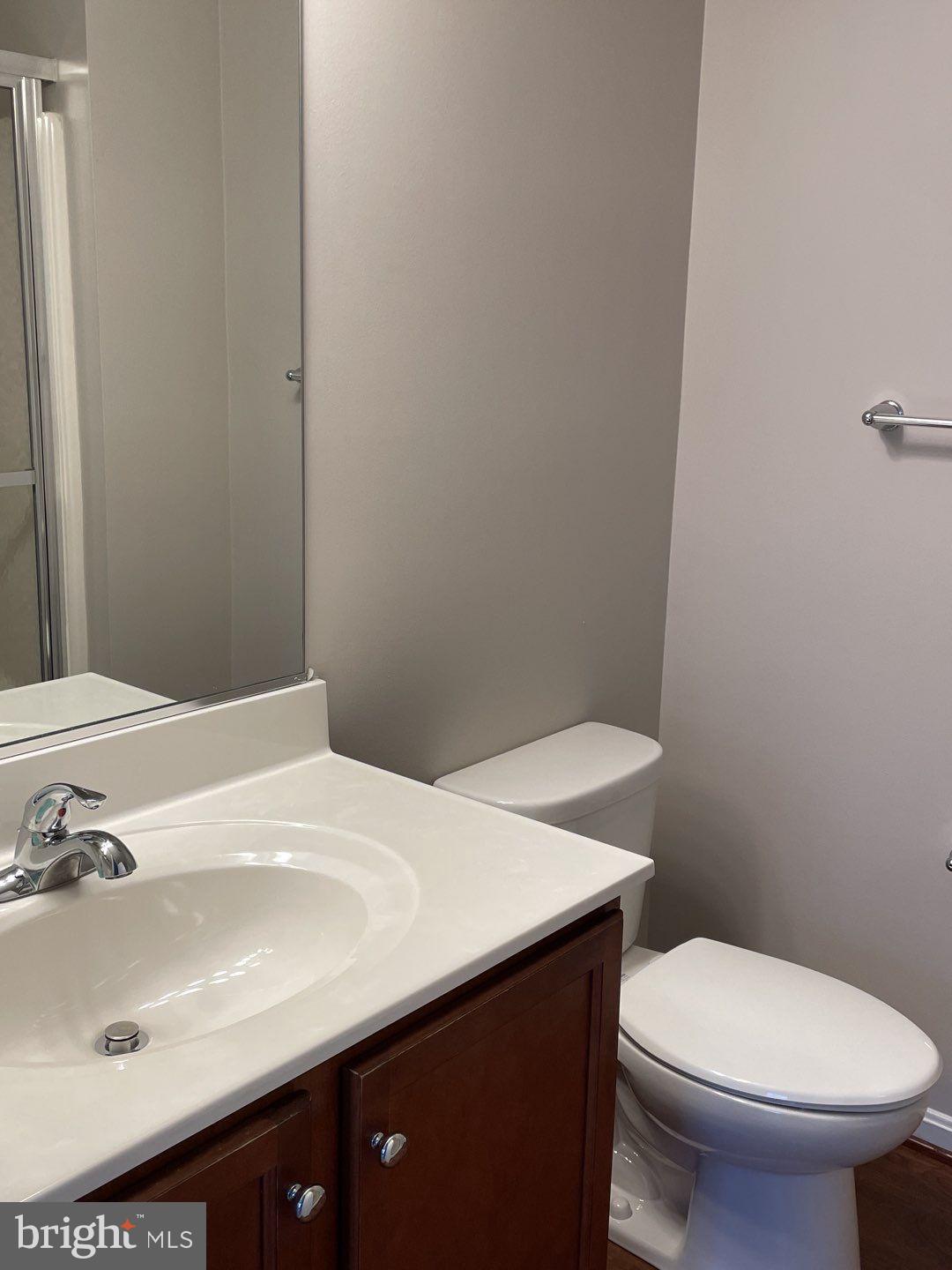 10366 College Square Columbia, MD 21044 - Photo 17 of 20 a bathroom with a sink and a toilet