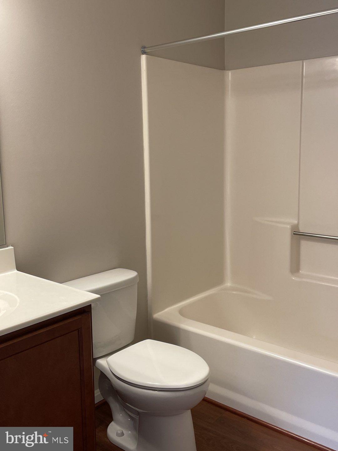 10366 College Square Columbia, MD 21044 - Photo 20 of 20 a white toilet sitting next to a bath tub