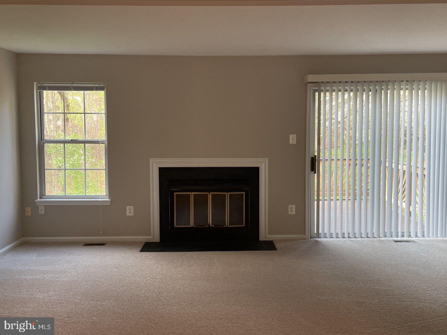 10366 College Square Columbia, MD 21044 - Photo 8 of 20 an empty room with a fireplace