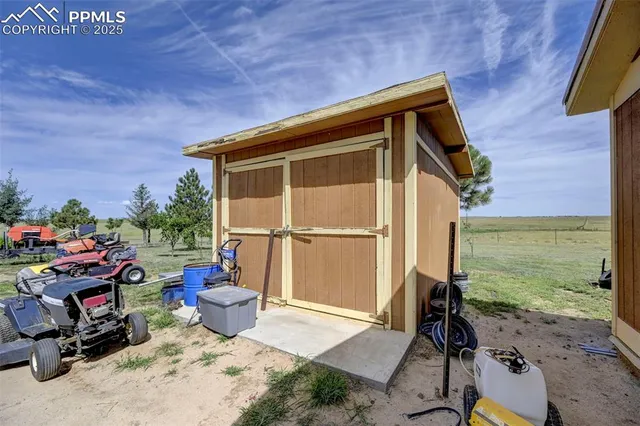 a view of a house with backyard porch and sitting area