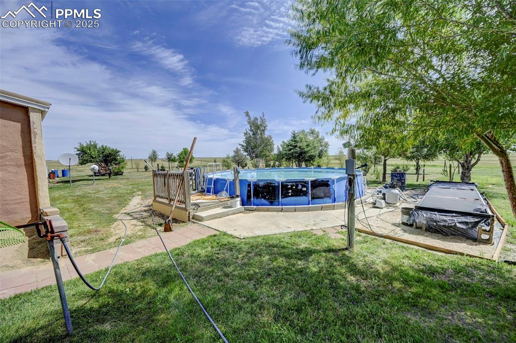 35875 Shear Road Yoder, CO 80864 - Photo 23 of 44 a view of a house with backyard porch and sitting area