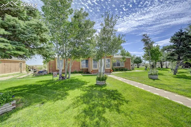 a view of a house with a big yard