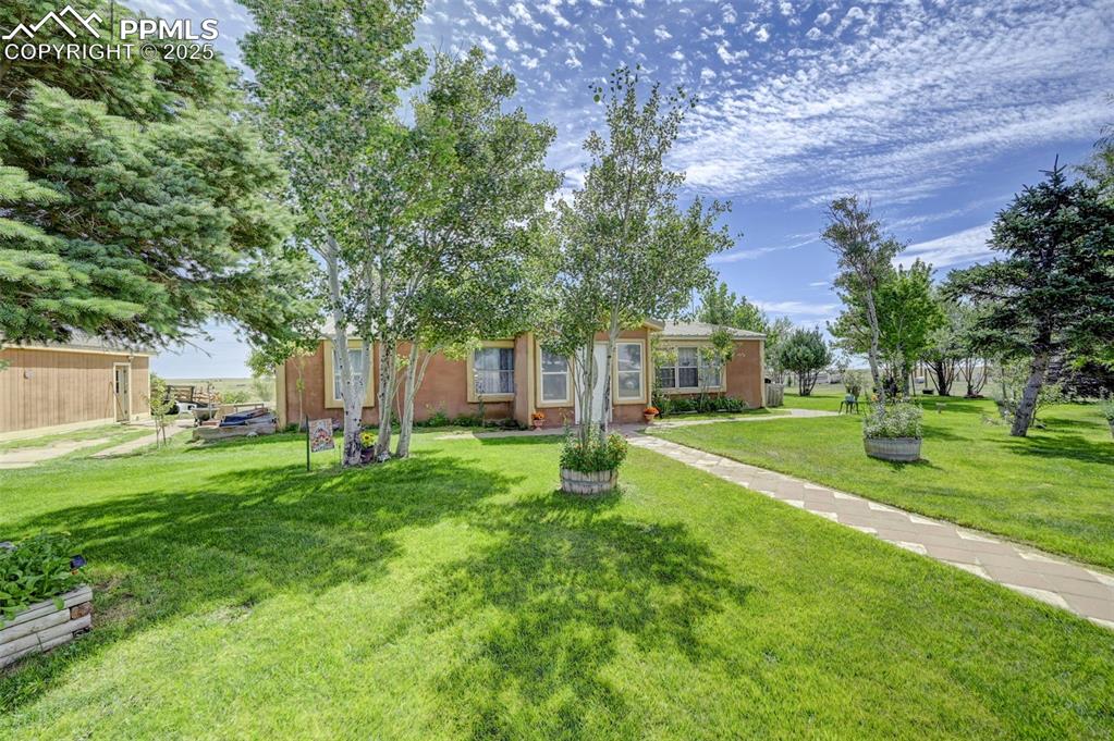 35875 Shear Road Yoder, CO 80864 - Photo 3 of 44 a view of a house with a big yard