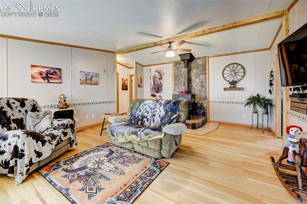 35875 Shear Road Yoder, CO 80864 - Photo 6 of 44 a living room with furniture and a flat screen tv