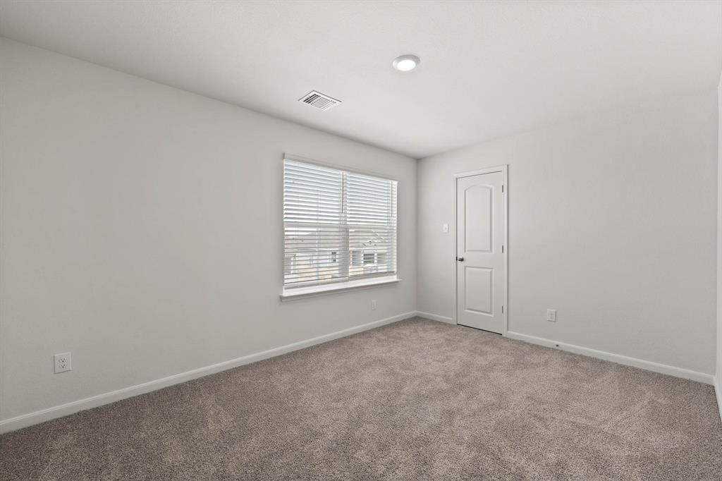 10141 Throttle Lane Fort Worth, TX 76131 - Photo 11 of 12 an empty room with windows