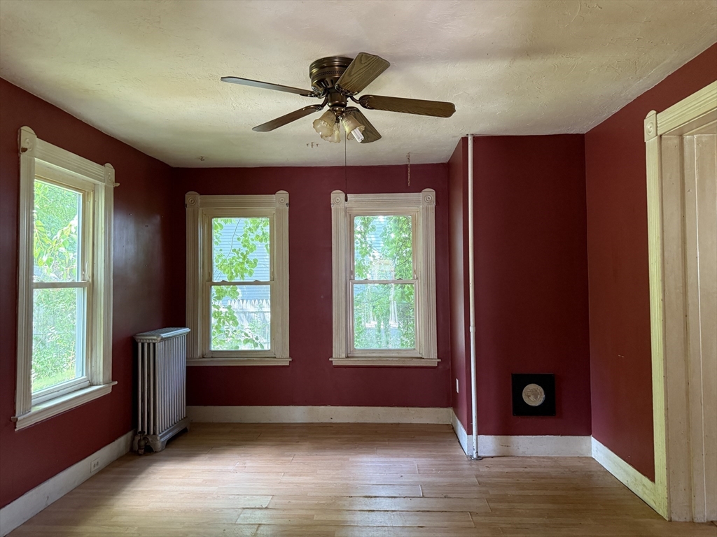 38 Elm Street Warren, MA 01083 - Photo 13 of 34 a view of an empty room with window and wooden floor
