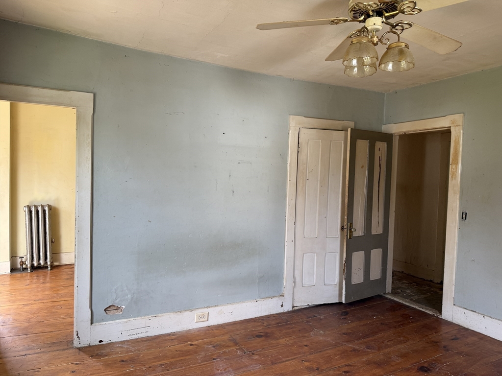 38 Elm Street Warren, MA 01083 - Photo 15 of 34 a view of an empty room with wooden floor and a window