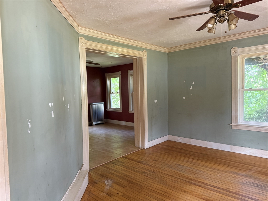 38 Elm Street Warren, MA 01083 - Photo 16 of 34 a view of a room with wooden floor and staircase