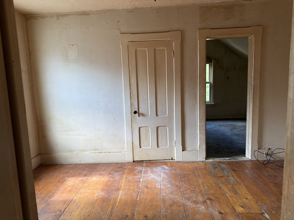 38 Elm Street Warren, MA 01083 - Photo 23 of 34 a view of an empty room with wooden floor