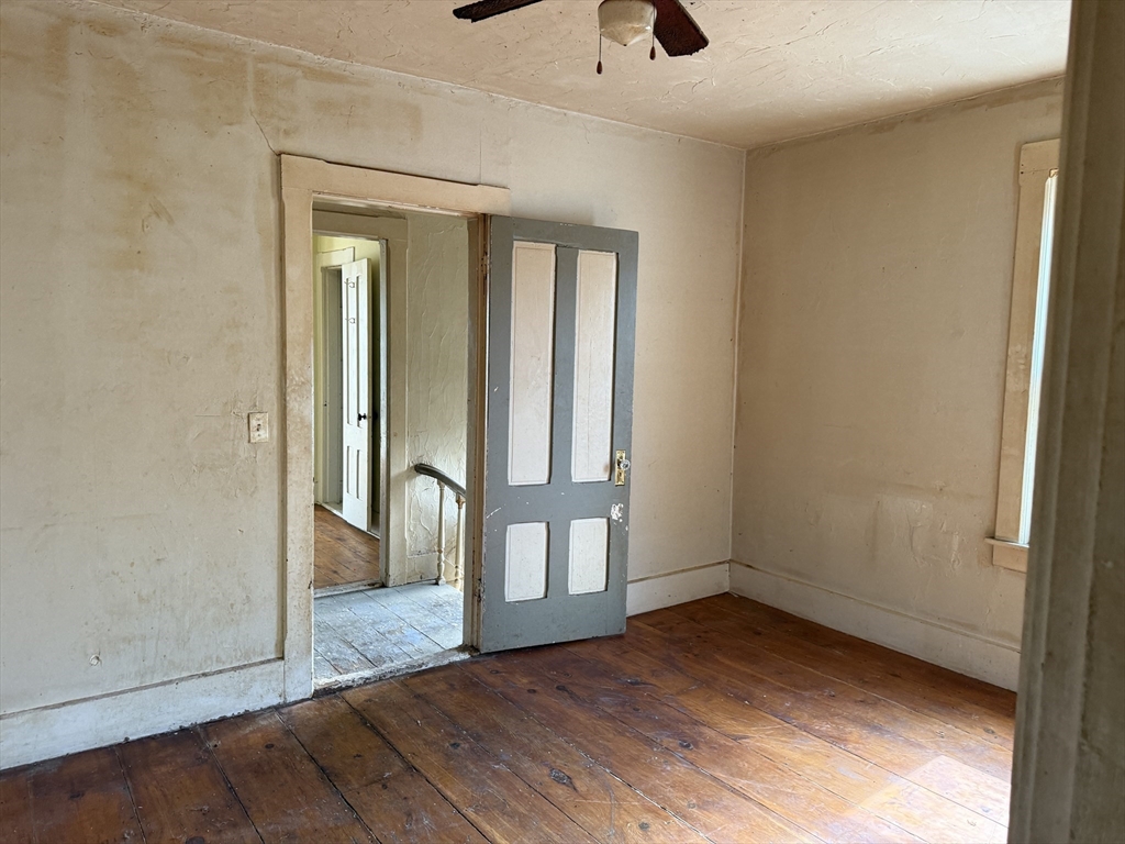 38 Elm Street Warren, MA 01083 - Photo 25 of 34 a view of an empty room with window and wooden floor