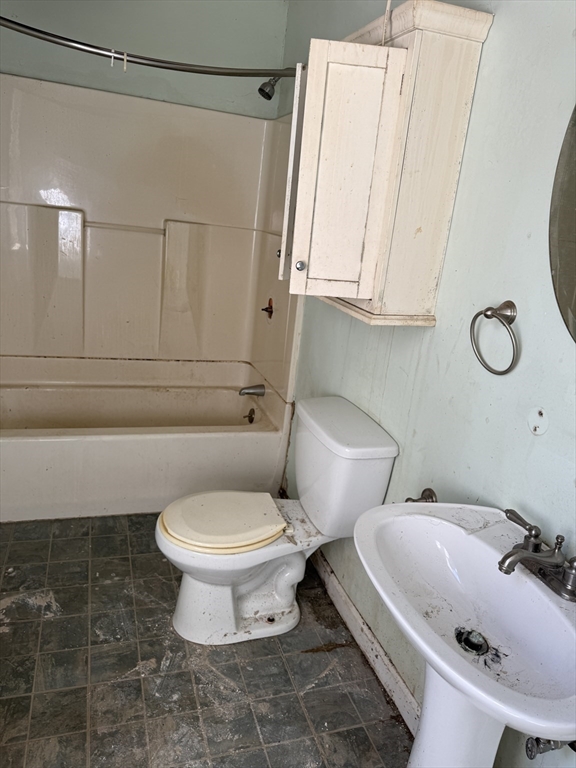 38 Elm Street Warren, MA 01083 - Photo 27 of 34 a white toilet sitting next to a bathroom sink