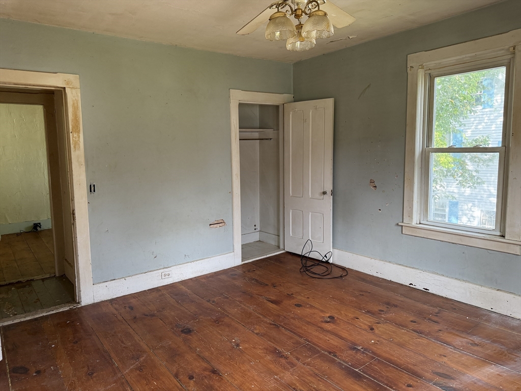 38 Elm Street Warren, MA 01083 - Photo 29 of 34 a view of an empty room with wooden floor and a window