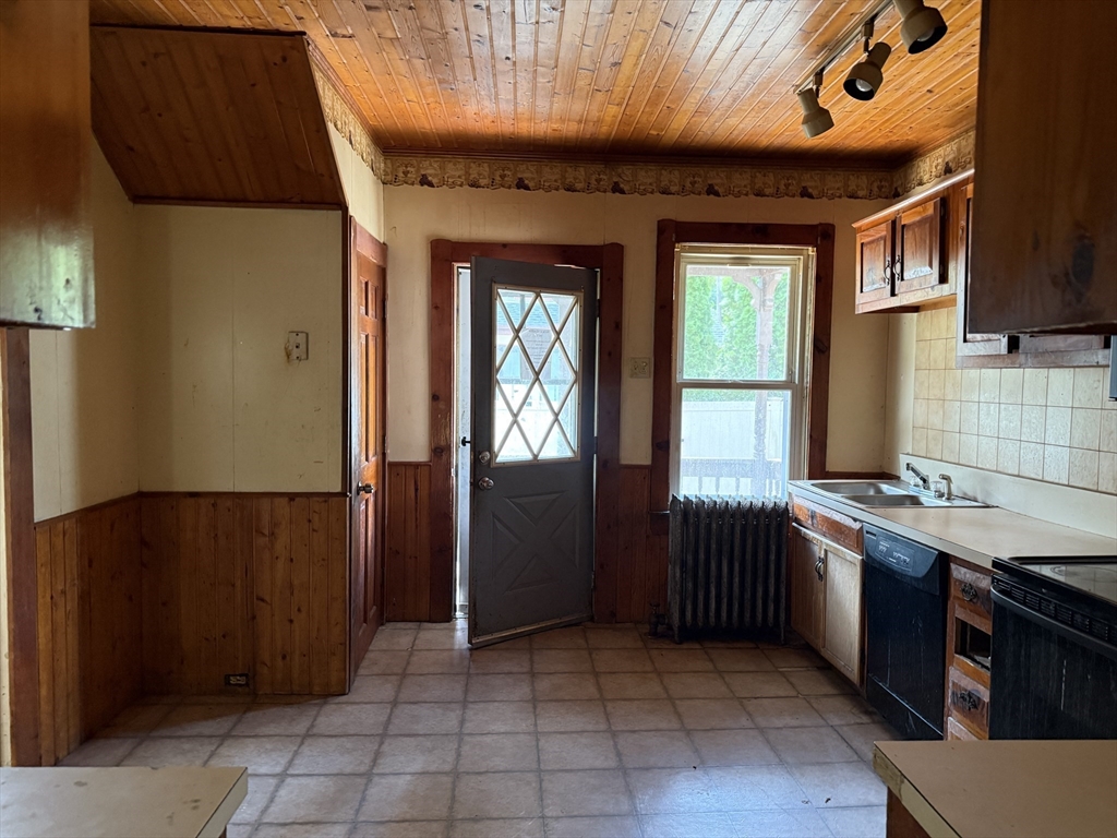 38 Elm Street Warren, MA 01083 - Photo 9 of 34 a kitchen with a wooden cabinets and a stove top oven