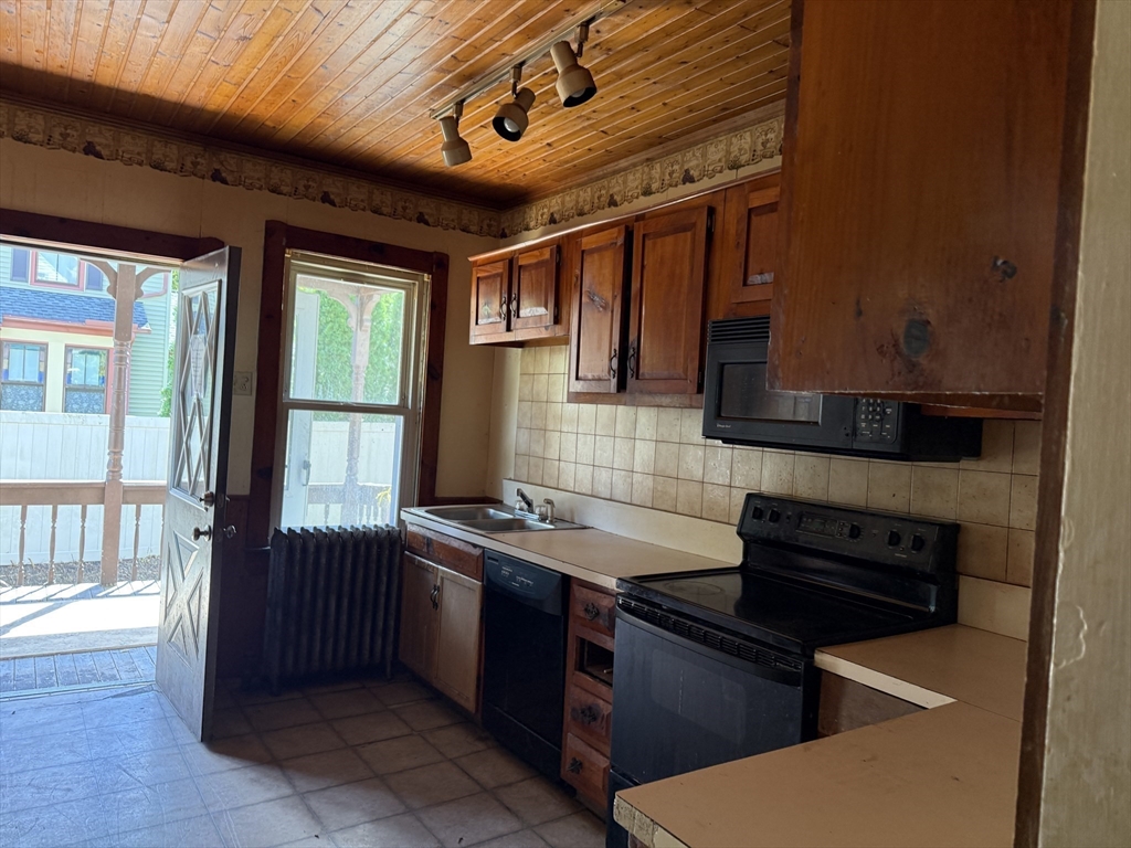 38 Elm Street Warren, MA 01083 - Photo 10 of 34 a kitchen with a sink and a stove top oven