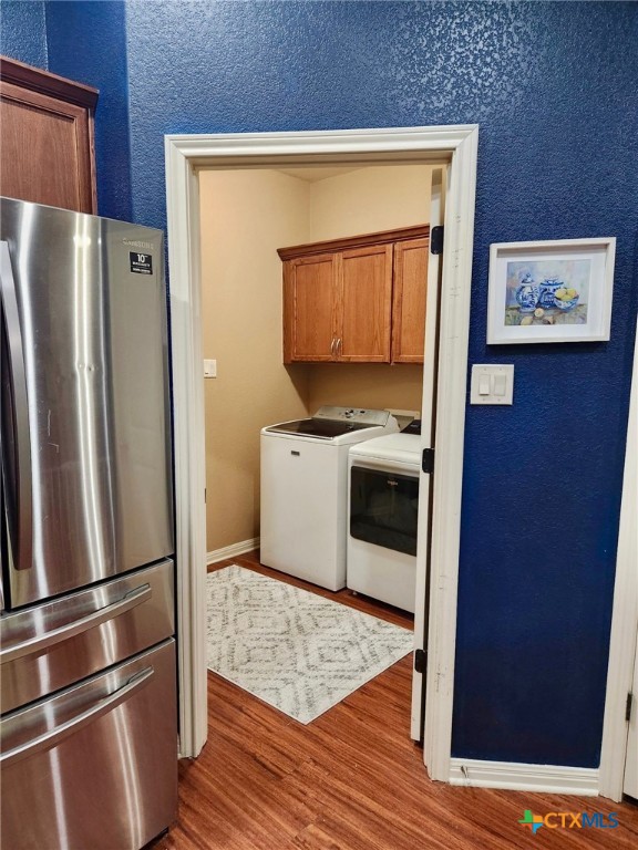 91 Skyview Terrace Leander, TX 78641 - Photo 16 of 25 a kitchen with stainless steel appliances a refrigerator sink and microwave