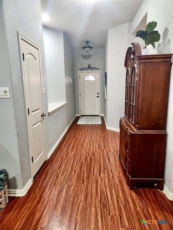 91 Skyview Terrace Leander, TX 78641 - Photo 3 of 25 a view of a hallway with wooden floor and staircase