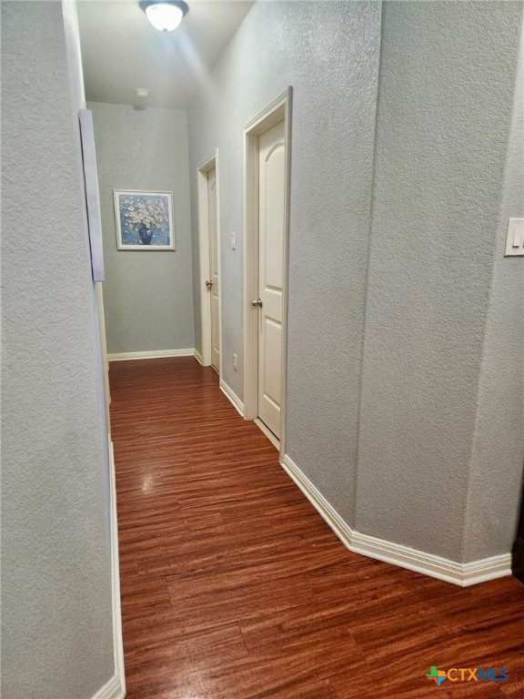 91 Skyview Terrace Leander, TX 78641 - Photo 4 of 25 a view of an empty room with wooden floor