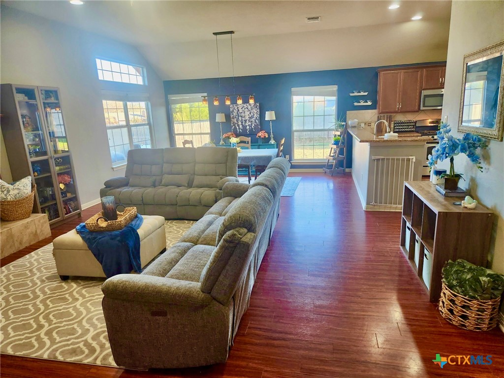 91 Skyview Terrace Leander, TX 78641 - Photo 10 of 25 a living room with furniture and a wooden floor