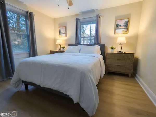 a bedroom with a bed and window