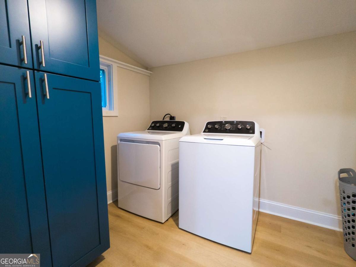6557 Woodrow Road Lithonia, GA 30038 - Photo 15 of 17 a utility room with dryer and washer