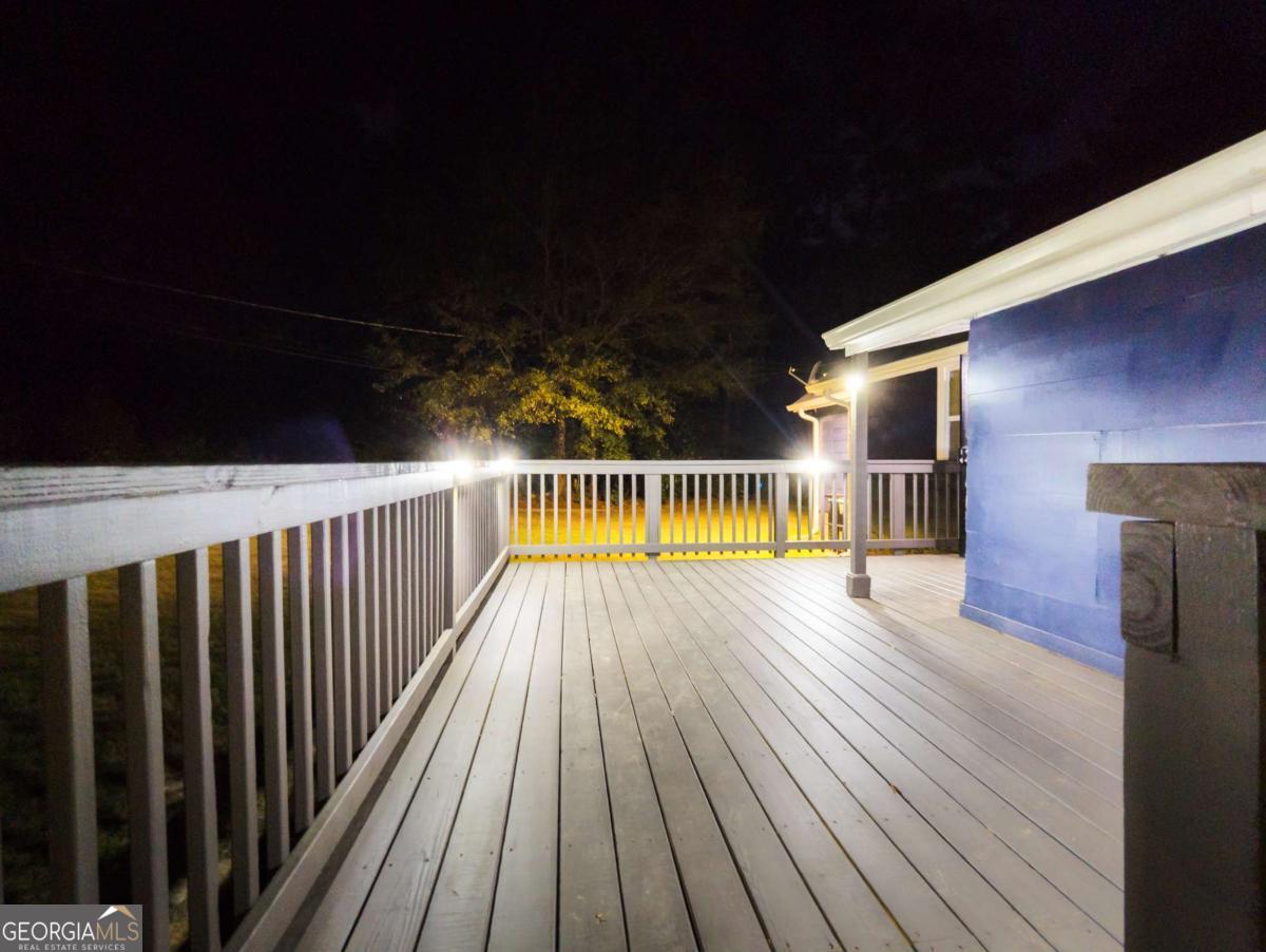 6557 Woodrow Road Lithonia, GA 30038 - Photo 16 of 17 a view of deck with wooden floor and outdoor space