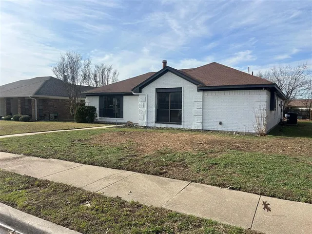 a house with trees in the background