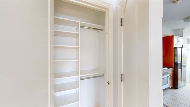 a close view of a utility room with dryer and washer