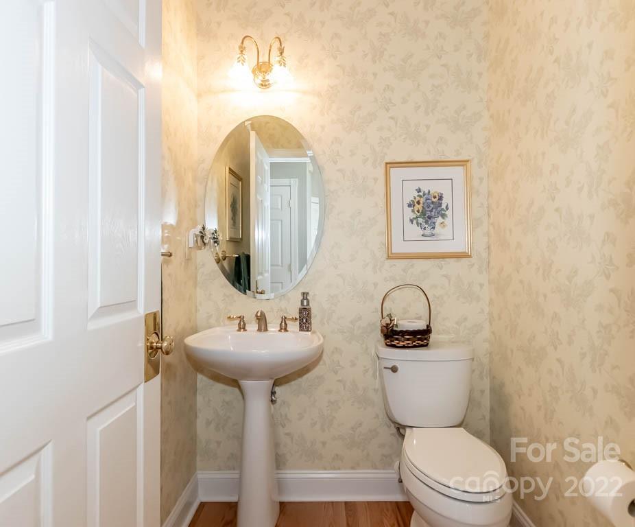 1629 Stevens Ridge Road Matthews, NC 28105 - Photo 16 of 39 a bathroom with a toilet sink and mirror