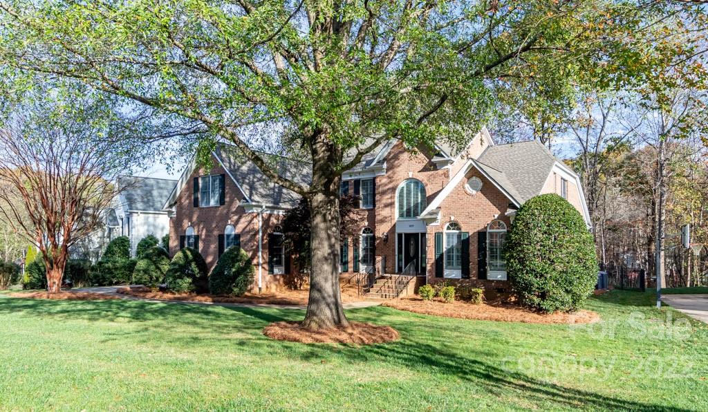 1629 Stevens Ridge Road Matthews, NC 28105 - Photo 2 of 39 a front view of a house with a yard