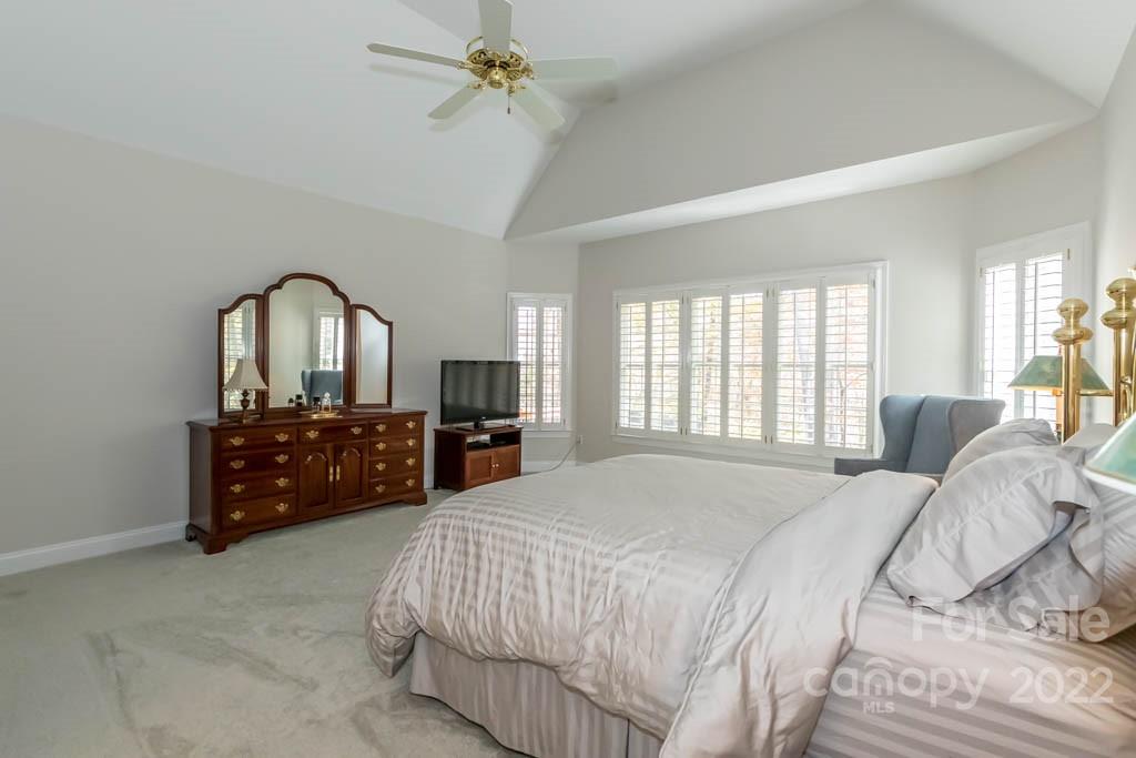 1629 Stevens Ridge Road Matthews, NC 28105 - Photo 26 of 39 a bedroom with a bed dresser and a large window