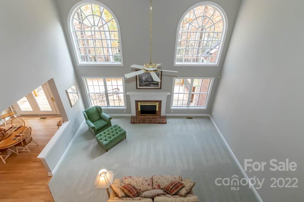 1629 Stevens Ridge Road Matthews, NC 28105 - Photo 31 of 39 a living room with furniture and a fireplace