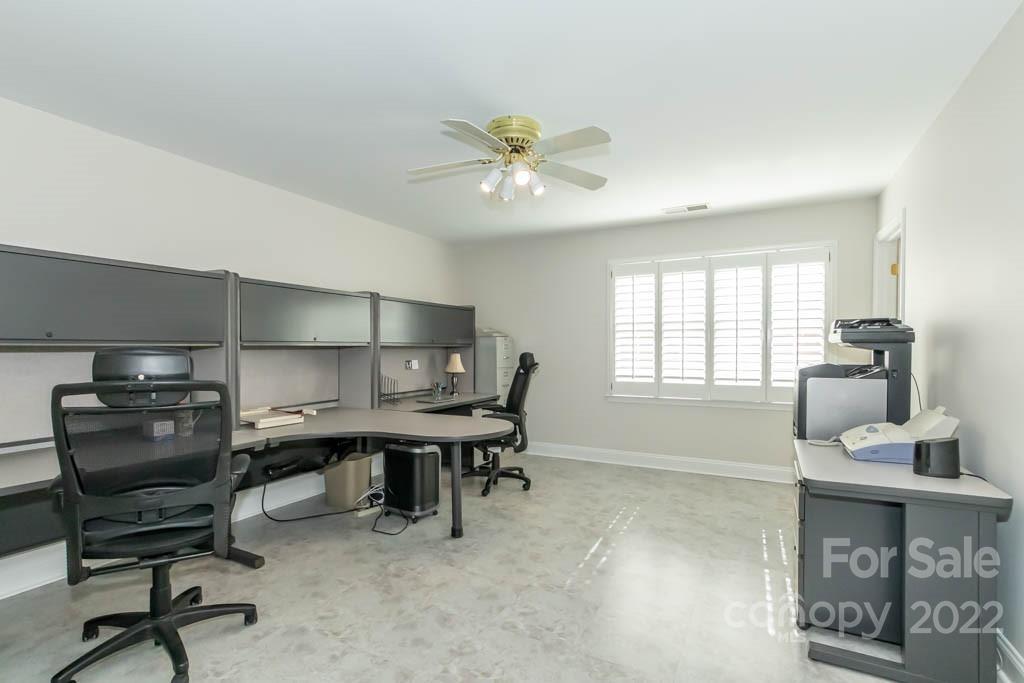 1629 Stevens Ridge Road Matthews, NC 28105 - Photo 34 of 39 a view of a workspace with furniture and a window