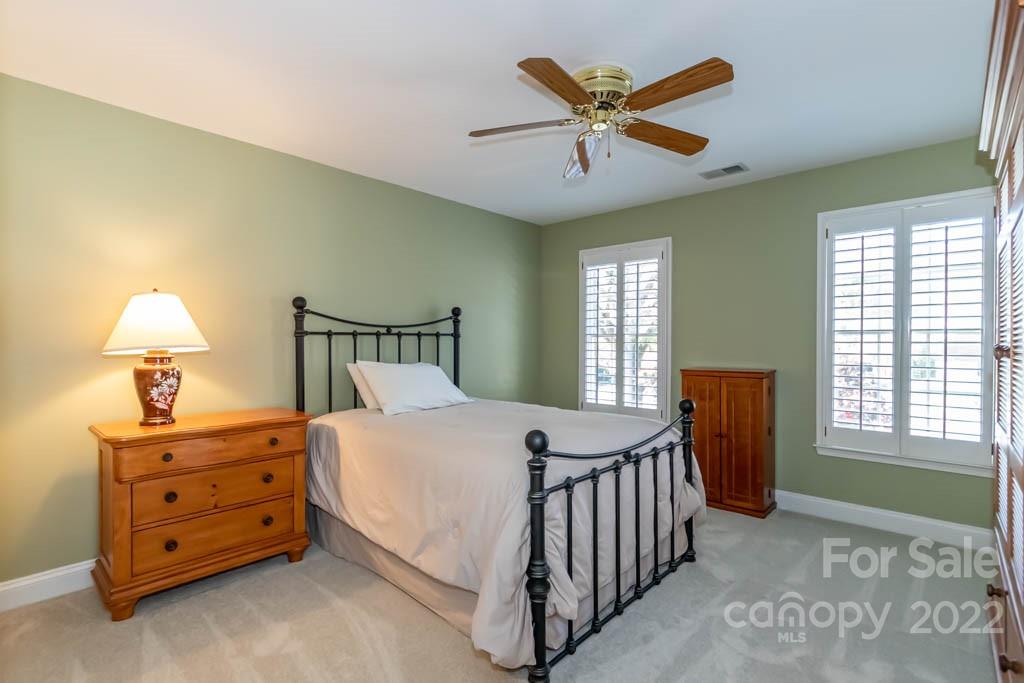 1629 Stevens Ridge Road Matthews, NC 28105 - Photo 35 of 39 a bedroom with a bed and a window